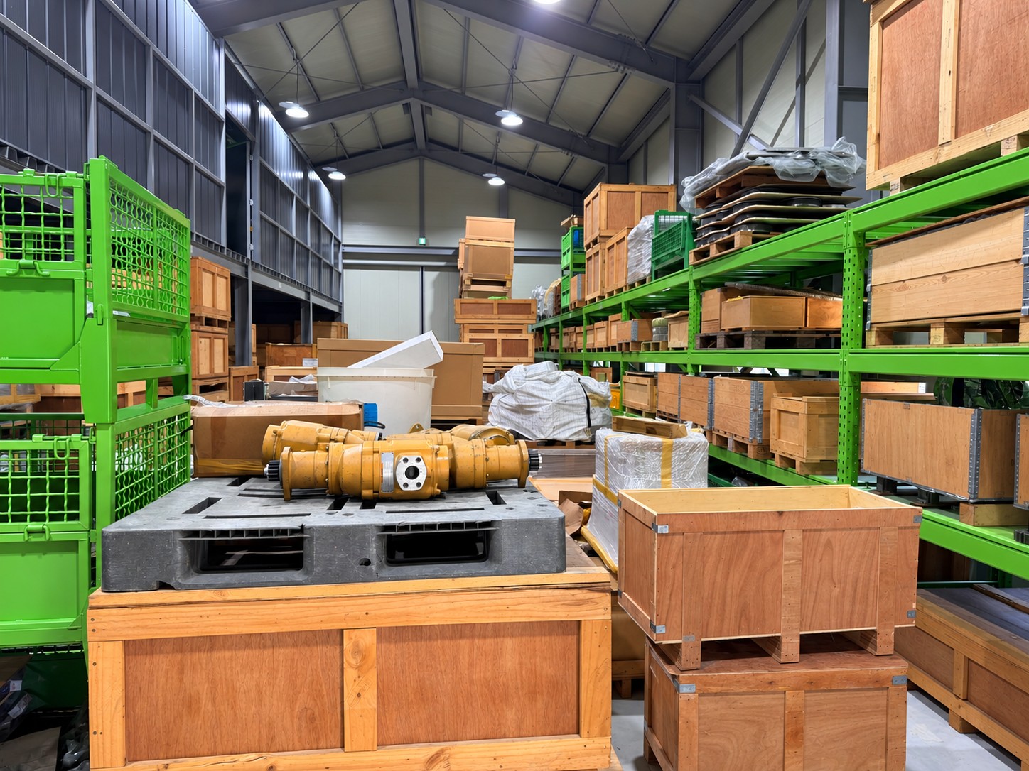 Crated and protected engine components on warehouse racks